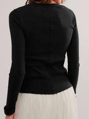 Black ribbed button-up second-skin top with long sleeves and a seam detail down the back.