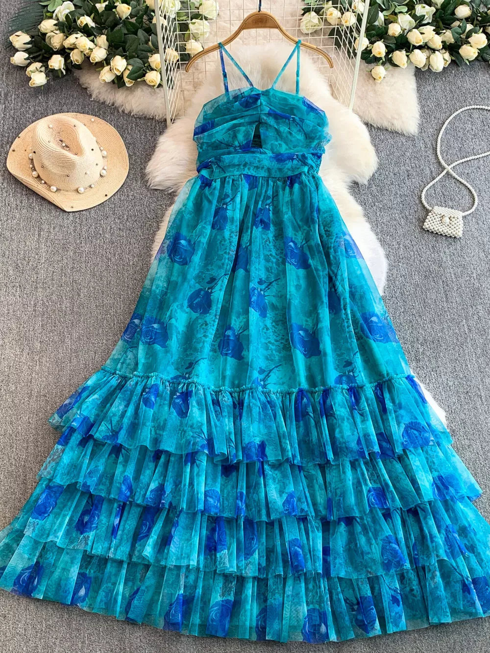 Blue floral mesh maxi dress with tiered ruffles and cutout bodice.