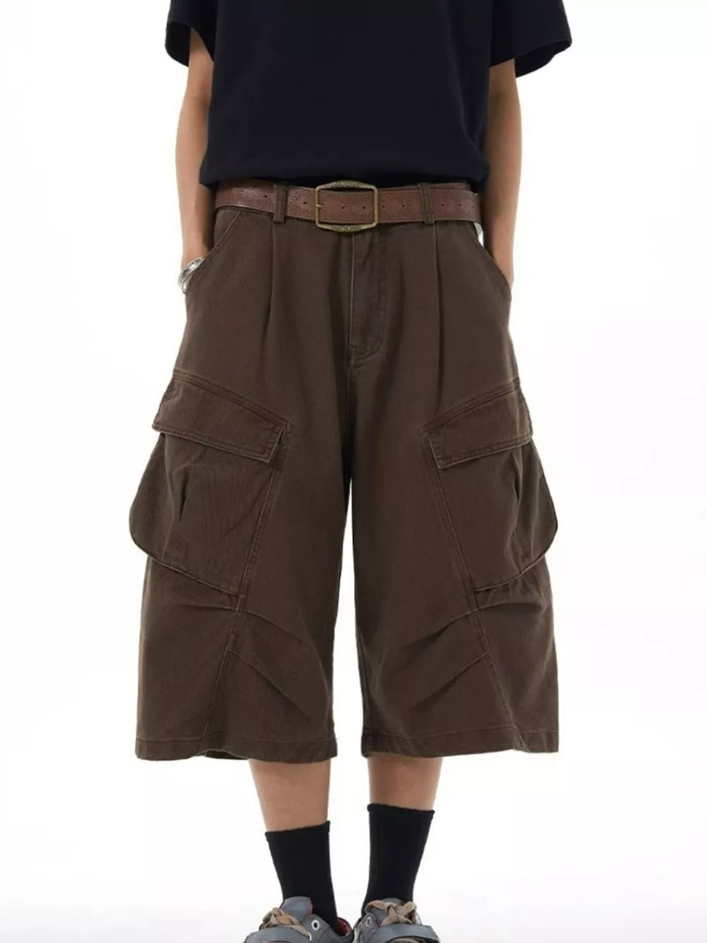 Chocolate relaxed fit cargo capris with large flap pockets and a brown belt.