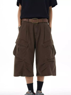 Chocolate relaxed fit cargo capris with large flap pockets and a brown belt.