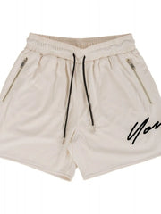 Beige BigFit jogger shorts with drawstring, zip pockets, and black script logo.