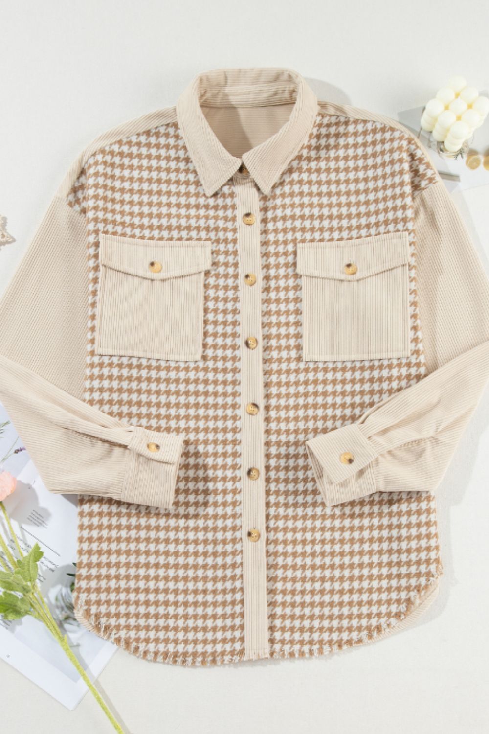 Beige houndstooth corduroy patchwork shacket with two chest pockets and button front.
