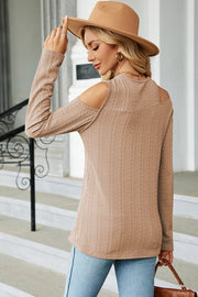 Textured cable knit cold shoulder top in camel with long sleeves.
