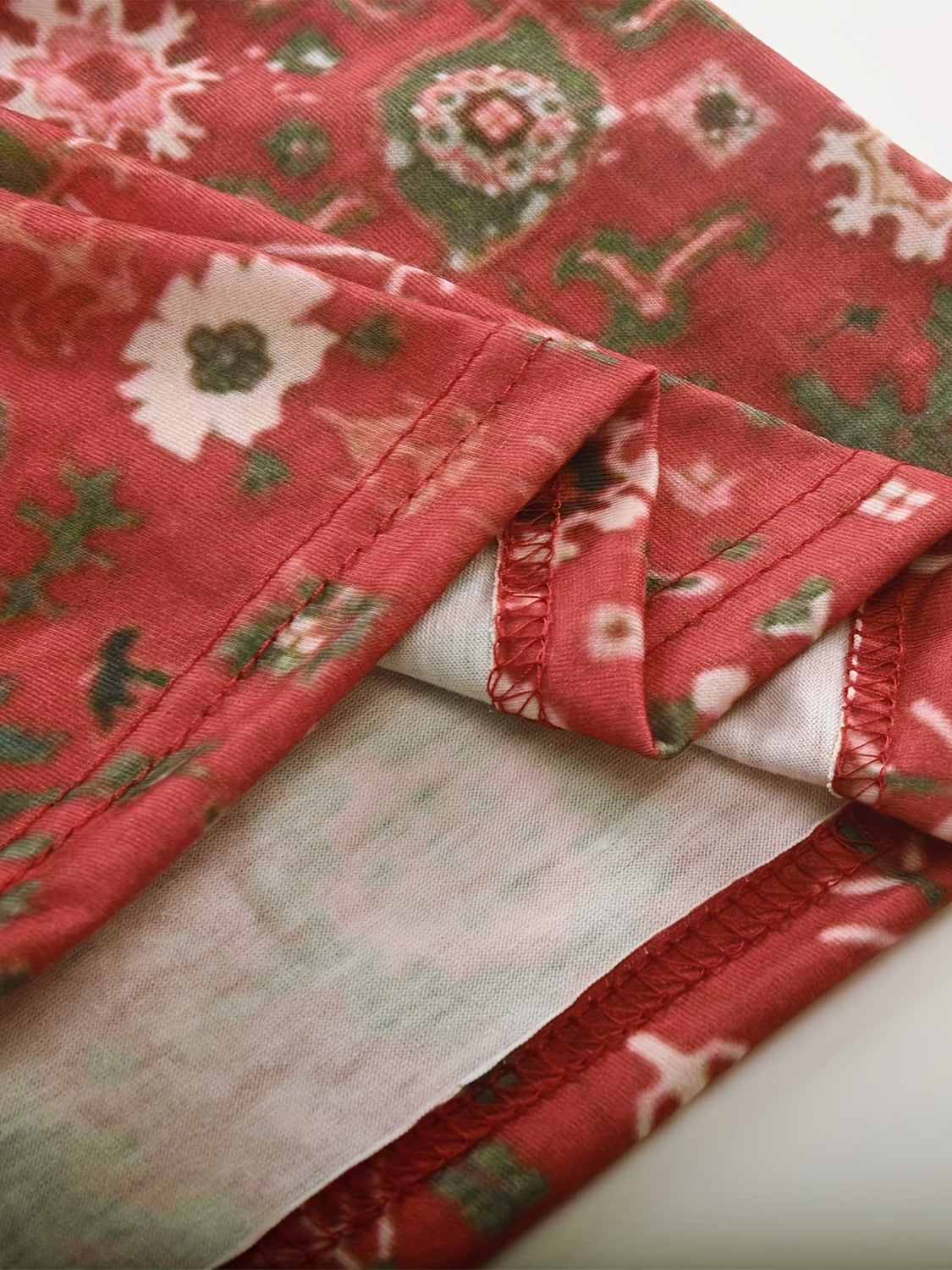 Bohemian tapestry blouse in Deep Red with floral print and detailed stitching.