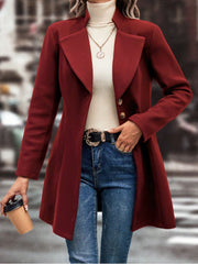 Burgundy wool coat with flared hemline, button front, and notched lapels.