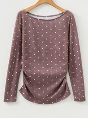 Coffee brown polka dot long-sleeve tee with boat neck and ruched sides.