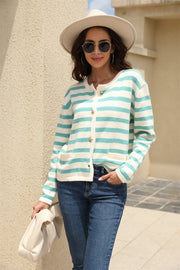 Crewneck cardigan with bold aqua and white stripes, button front, and two pockets.