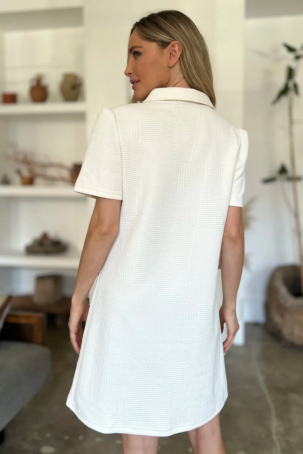 Textured ivory mini dress with short sleeves and a collared neckline.