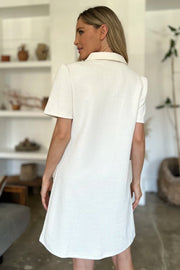 Textured ivory mini dress with short sleeves and a collared neckline.