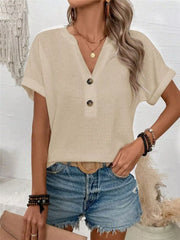 Apricot waffle knit V-neck t-shirt with button detail and cuffed sleeves.