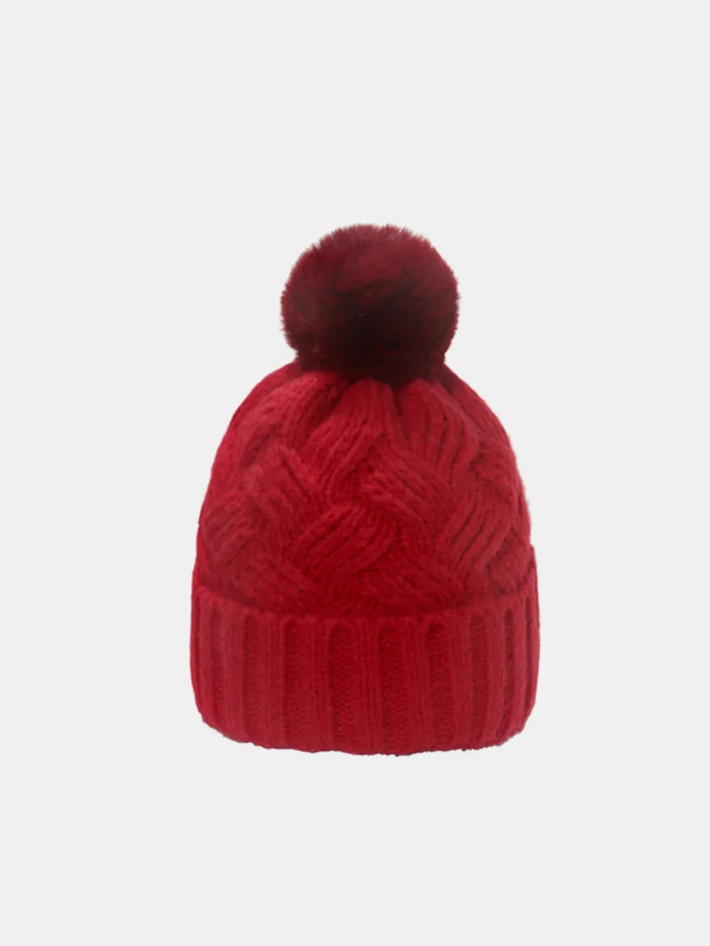 Deep Red cable knit pom beanie with ribbed cuff and textured pattern.