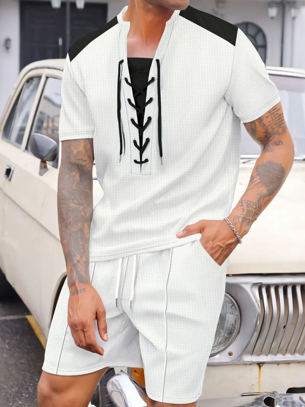 Ivory waffle knit lounge set with lace-up neckline and contrast black yoke.