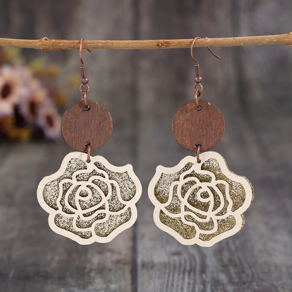 Layered rosewood drop earrings with rose design and glitter detail.
