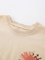 Toddler graphic tee in beige cotton with a sun print and crew neck detail.