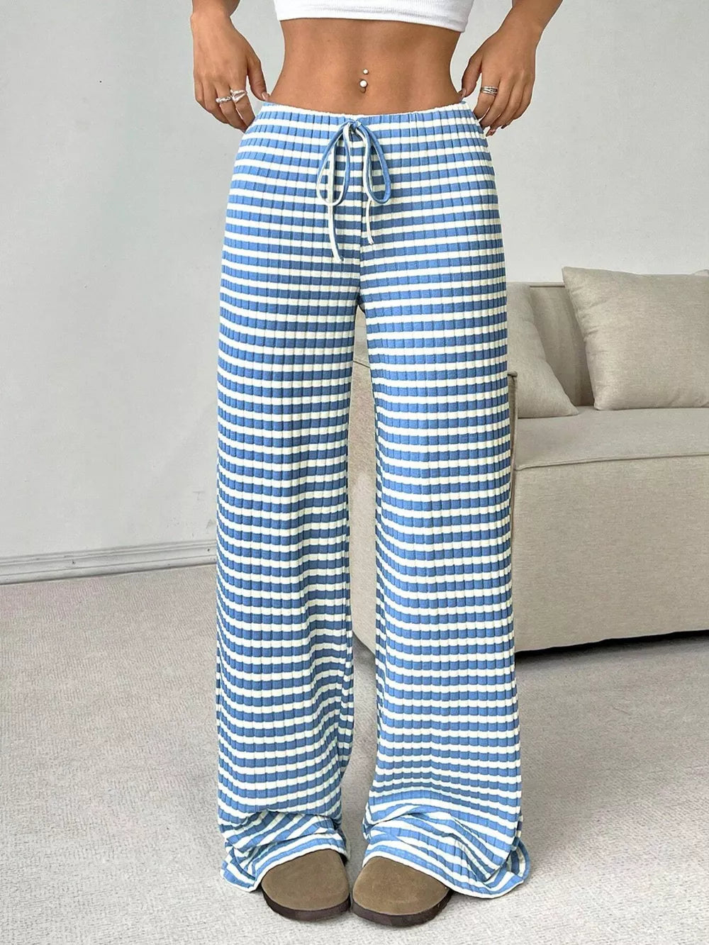 Light blue ribbed wide-leg pants with white stripes and drawstring waist