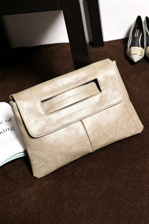Light gray distressed leather envelope clutch with cut-out handle detail