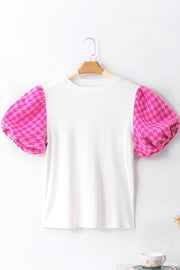 White ribbed knit blouse with pink houndstooth puff sleeves.