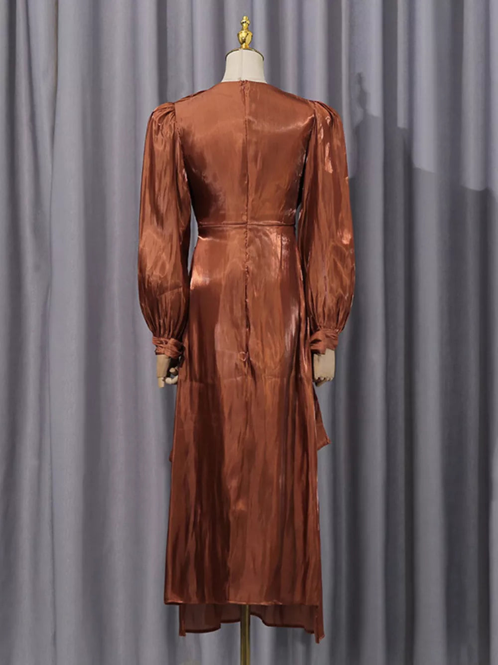 Brown satin maternity maxi dress with ruched bodice and balloon sleeves.