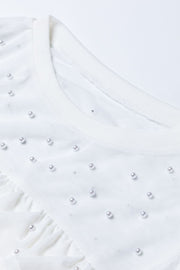White mesh bodysuit with pearl embellishments and ruffled detail