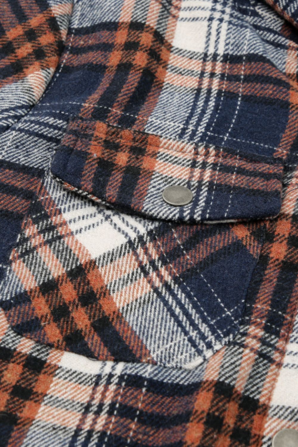 Sherpa-lined plaid overshirt jacket with button flap pockets in navy, tangerine, and white plaid.
