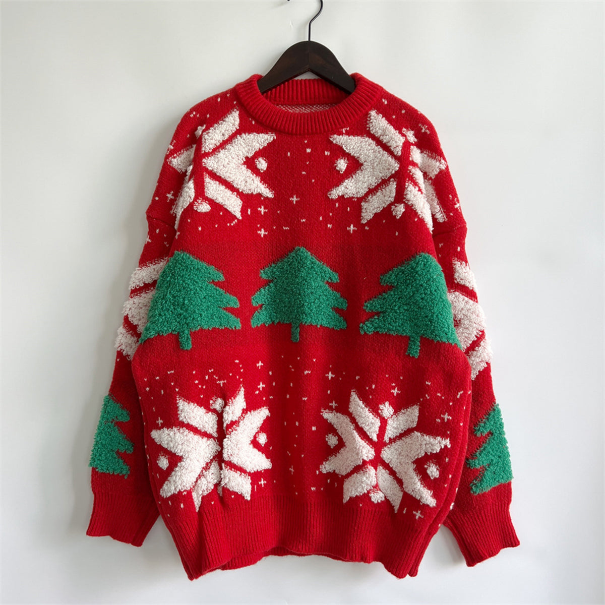 Red acrylic knit sweater with green Christmas trees and white snowflakes.