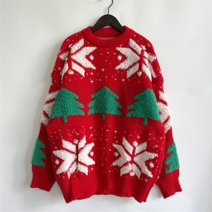 Red acrylic knit sweater with green Christmas trees and white snowflakes.