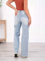 Light wash denim wide-leg cargo jeans with utility pockets and a relaxed fit.