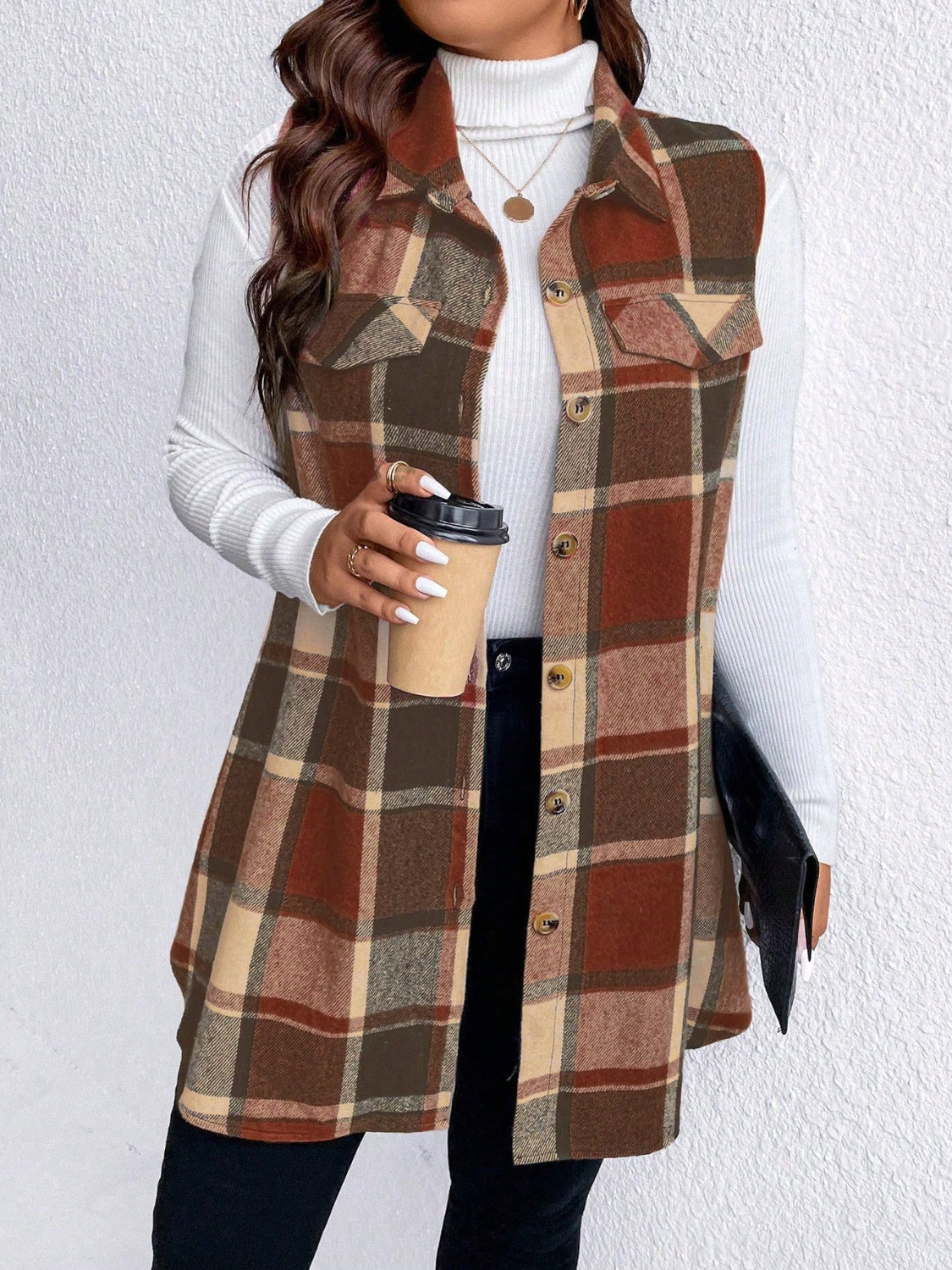 Oversized plaid shirt vest in brown with button front and chest pockets.
