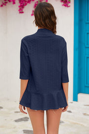 Dark blue perforated peplum sleeve cardigan with a ruffled hem.