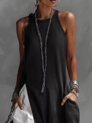 Black two-tone maxi dress with pockets and a halter neckline.