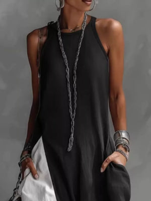 Black two-tone maxi dress with pockets and a halter neckline.