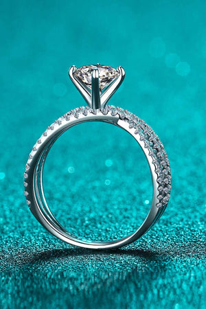 Silver pavé-set crossover engagement ring with a large center stone.