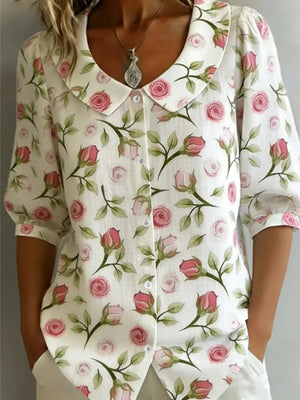 Floral print Peter Pan collar blouse with button-down front and puff sleeves