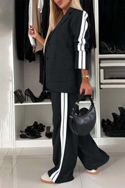 Black track stripe blazer and trouser set with white side stripes.