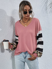 Blush pink waffle knit v-neck top with striped and leopard print sleeves