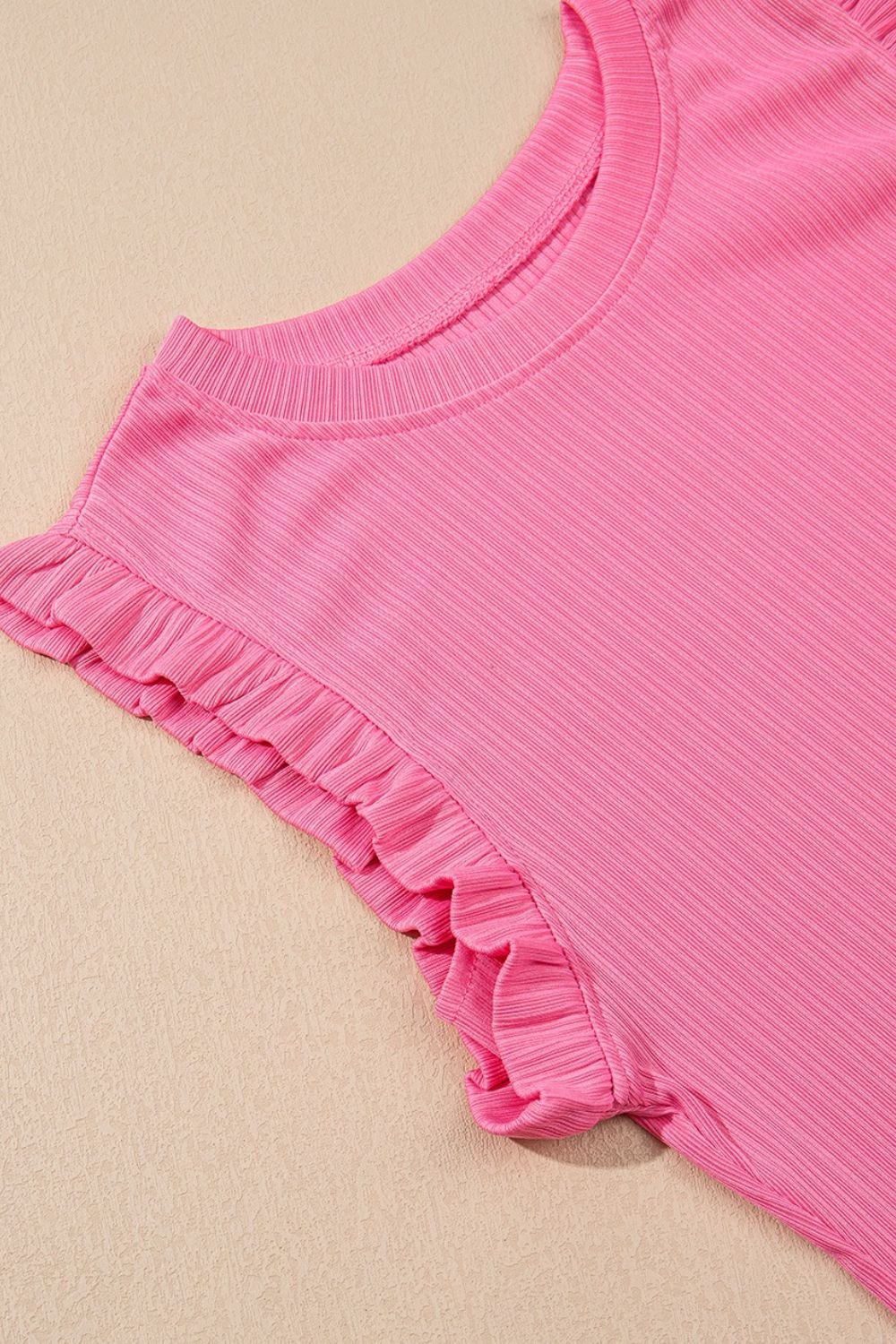 Pink ribbed co-ord set top with ruffled cap sleeves and crew neck.