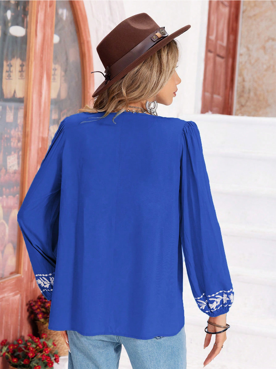 Royal blue embroidered yoke blouse with gathered bodice and balloon sleeves.