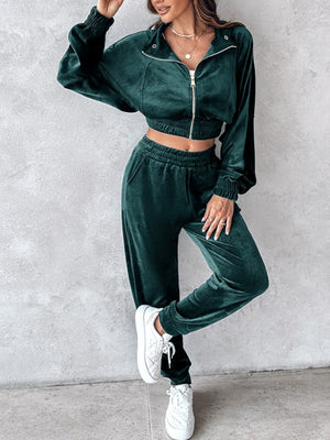 Deep Teal velvet crop tracksuit with zipper detail and elastic cuffs.