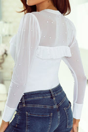 White mesh bodysuit with pearl embellishments and ruffled yoke detail.
