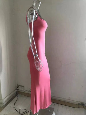 Spaghetti strap bodycon maxi dress in pink with a flared hem.