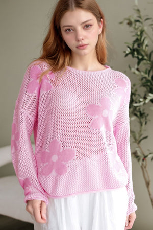 Openwork floral intarsia sweater in blush pink acrylic.