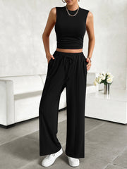 Black ribbed crop top and wide-leg lounge pants with drawstring waist.