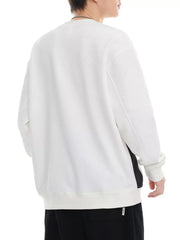White crew-neck sweatshirt with a textured chevron pattern and ribbed cuffs.