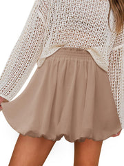 Taupe bubble hem mini skirt with elastic waist, shown with a white crochet top.