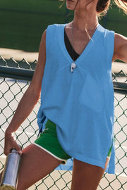 Oversized blue V-neck tank top with a chest pocket and side slits.