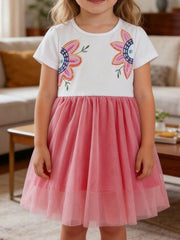 Toddler dress with white top, embroidered flowers, and pink tulle skirt.