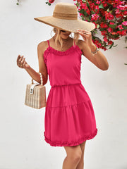 Ruffled camisole tiered mini dress in hot pink with ruffled hem and neckline.