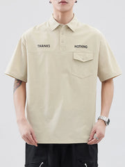 Apricot polo shirt with button detail, chest pocket, and "THANKS NOTHING" text.