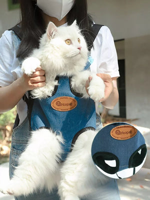 Blue denim-like pet carrier backpack with adjustable straps and leg openings.