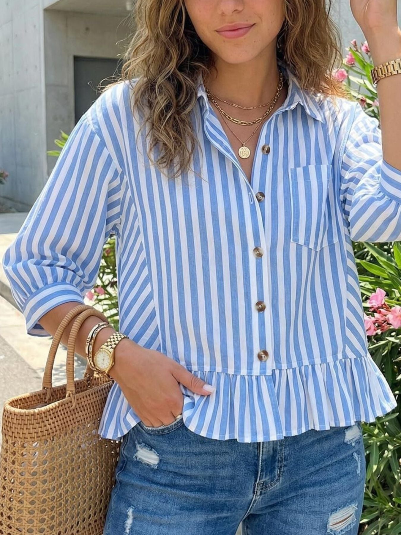 Button-down shirt with ruffle hem in sky blue and white stripes, 3/4 sleeves, casual chic style.